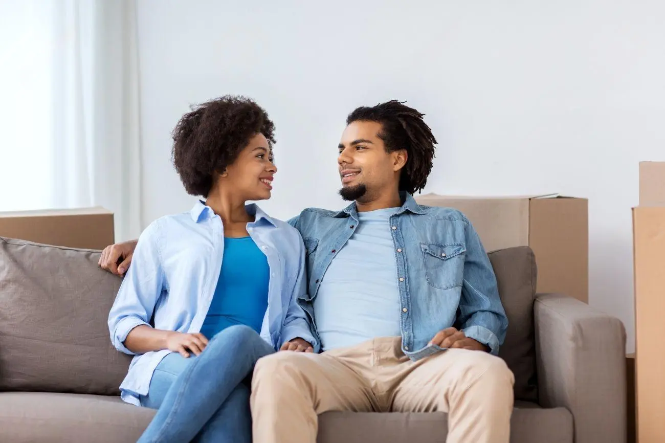 A couple sitting together at home